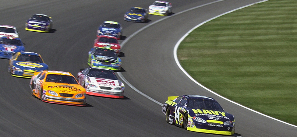 Stock cars racing in the Grand National Divisional race at Iowa Speedway in May, 2015